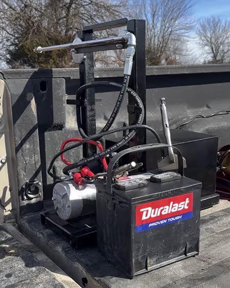 The CowHand fogger stand in use, easily going above the bed of the pickup truck